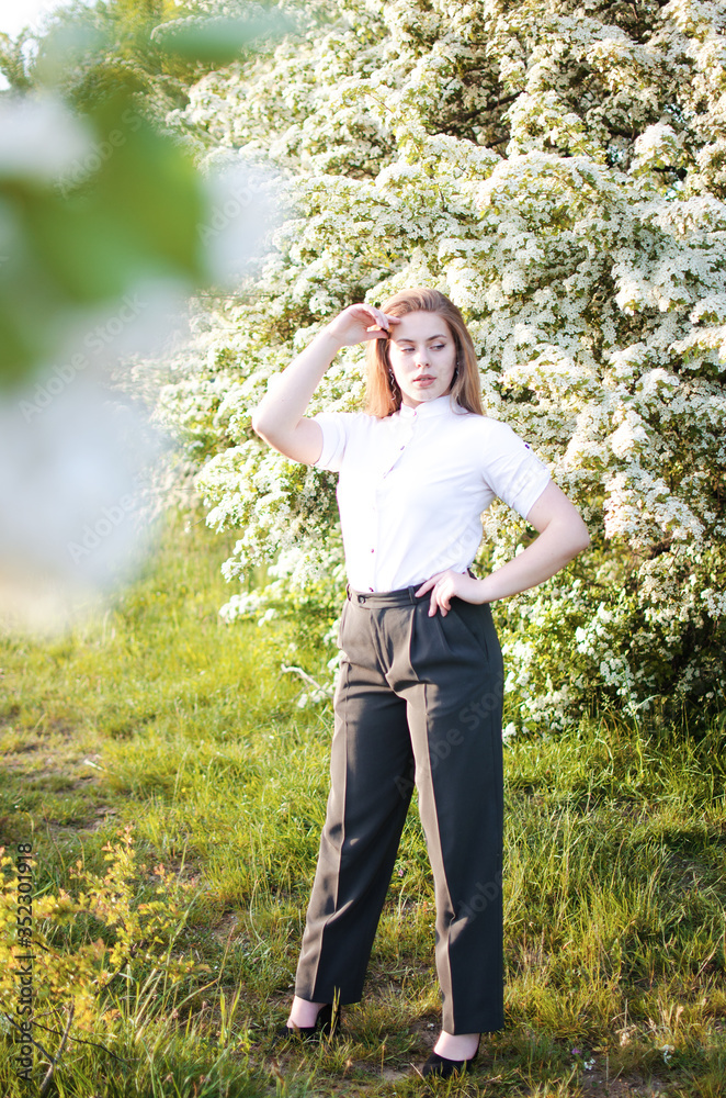 Happy girl with long hair walking in the spring Happy girl with long hair walking in the spring