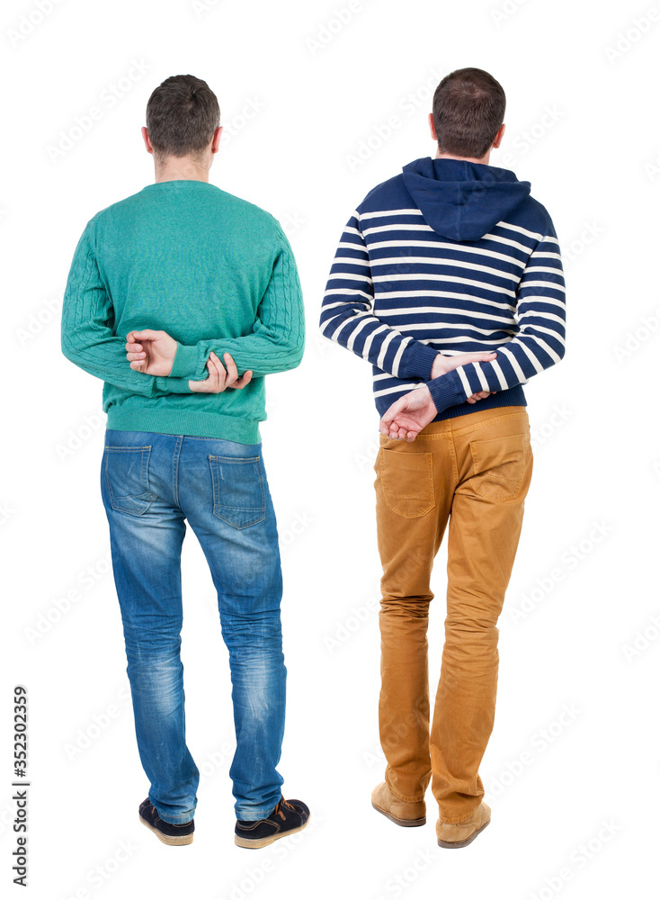Back view of two man in sweater pointing. Back view of two man in sweater pointing.
