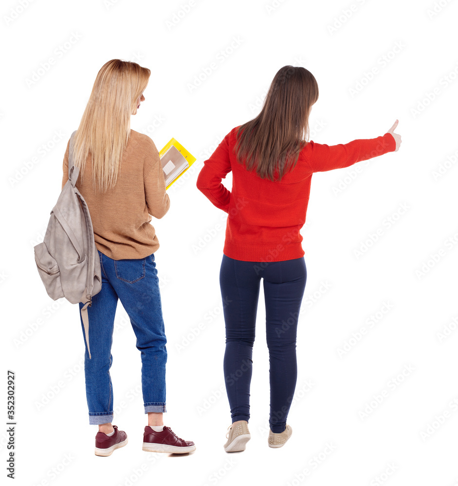 Back view of couple in sweater showing thumbs up. Back view of couple in sweater showing thumbs up.