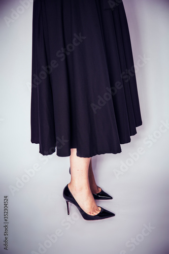 Woman black dress and black shoes collection 