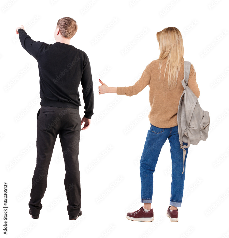 Back view of couple in sweater with mobile phone. Back view of couple in sweater with mobile phone.