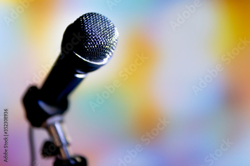 Image of a microphone on a colored background.