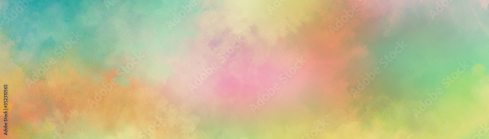 Colorful watercolor background of abstract sunset sky with puffy clouds in bright rainbow colors of pink green blue yellow orange and purple