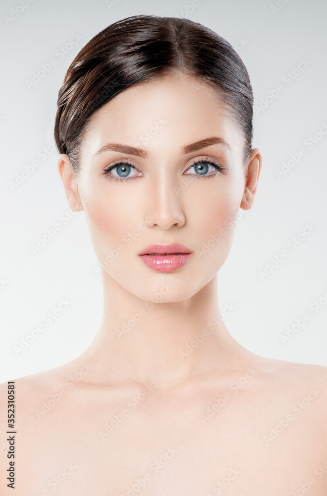 Beautiful face of young adult woman with clean fresh skin. Looking at Camera. Beautiful face of young adult woman with clean fresh skin. Looking at Camera.