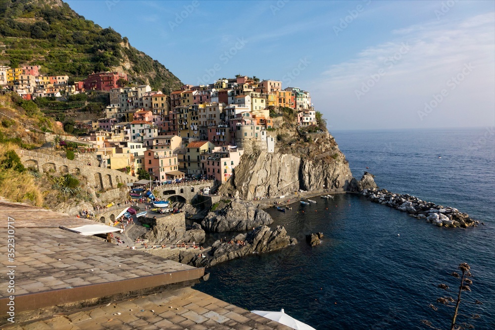 view of Manarola vilage in Cinque Terre with it's marvelous vivid houses on rocks near the sea