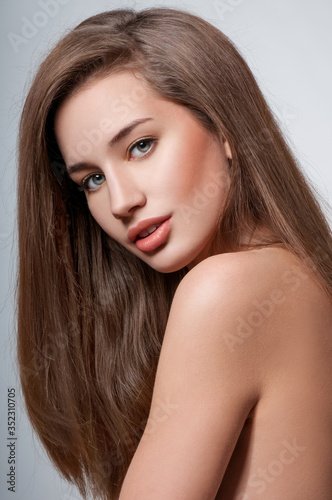 Beauty Woman with Long Brown Hair.Gorgeous Hair.Professional Makeup.