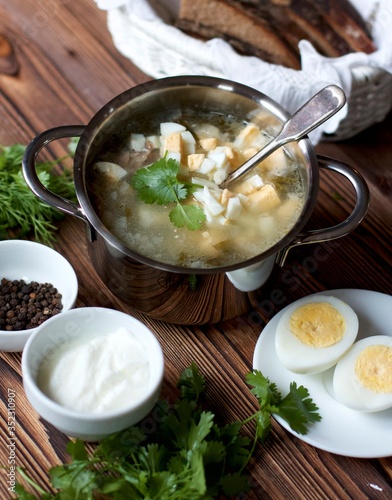 Chicken soup with herbs and homemade eggs