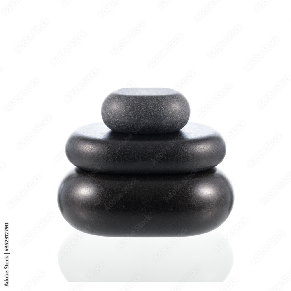 Pyramid of black basalt zen stones for hot massage isolated on white. Pyramid of black basalt zen stones for hot massage isolated on white.