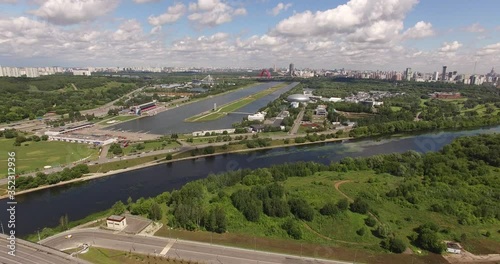 4K aerial summer late afternoon high quality video footage of new road highway, Grebnoi rowing water sports channel, cloudy sky in suburb Krilatskoye, Moscow River watercourse in Moscow, Russia photo