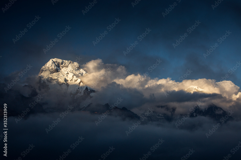 Landscape with Annapurna South peak view from Tadapani during trekking in Himalaya Mountains, Nepal
