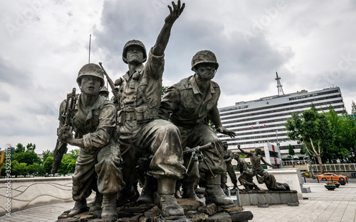 Seoul, South Korea - July 10 2018: Monument of the Korean war veterans outside of the War Memorial of Korea (전쟁기념관).  photo