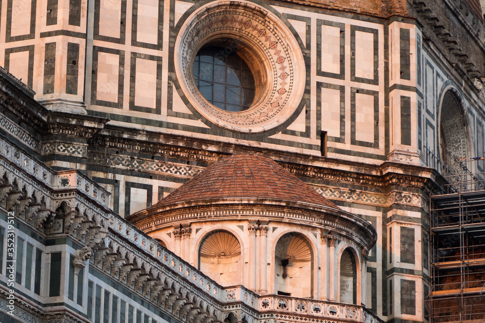 Exterior / facade of the Cathedral of Santa Maria del Fiore in Florence, Italy. Closer look onto a part of the dome with round window