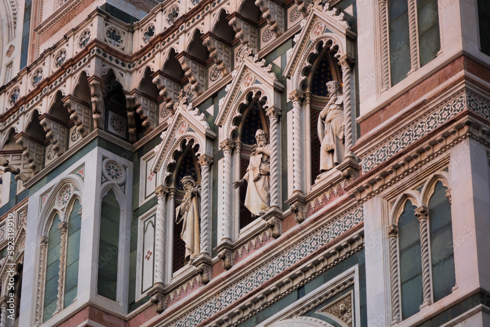 Exterior / facade of the Cathedral of Santa Maria del Fiore in Florence, Italy. Close shot of decoration and art of the front fasade of the cathedral
