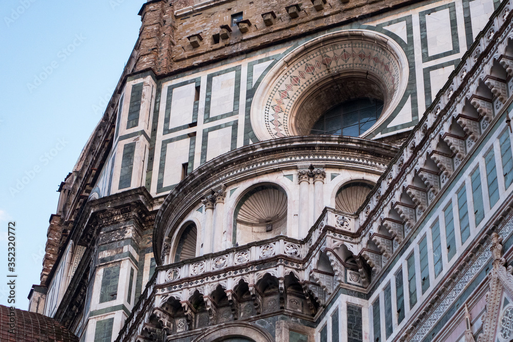 Exterior / facade of the Cathedral of Santa Maria del Fiore in Florence, Italy. Closer look onto a part of the dome with round window
