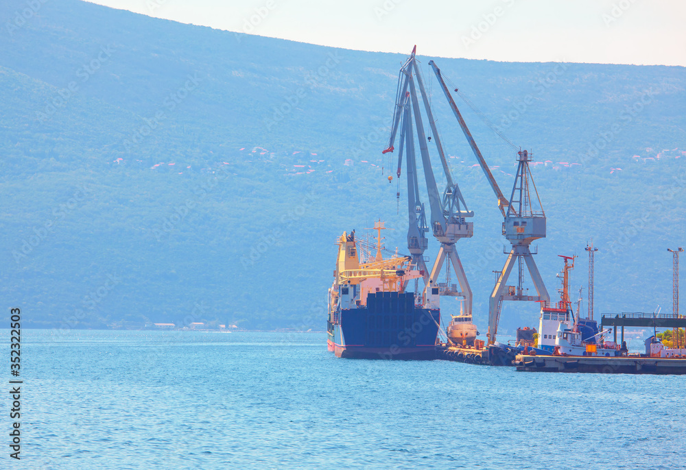 Naklejka premium sea port with industrial cranes 
