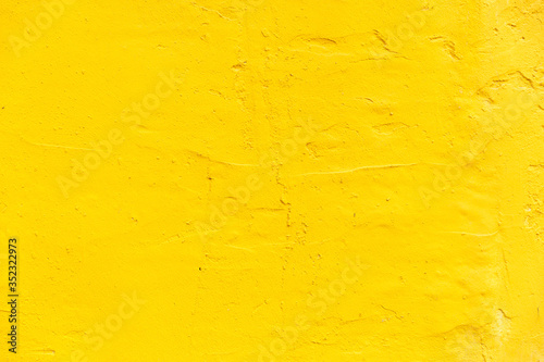 yellow colored concrete wall texture background