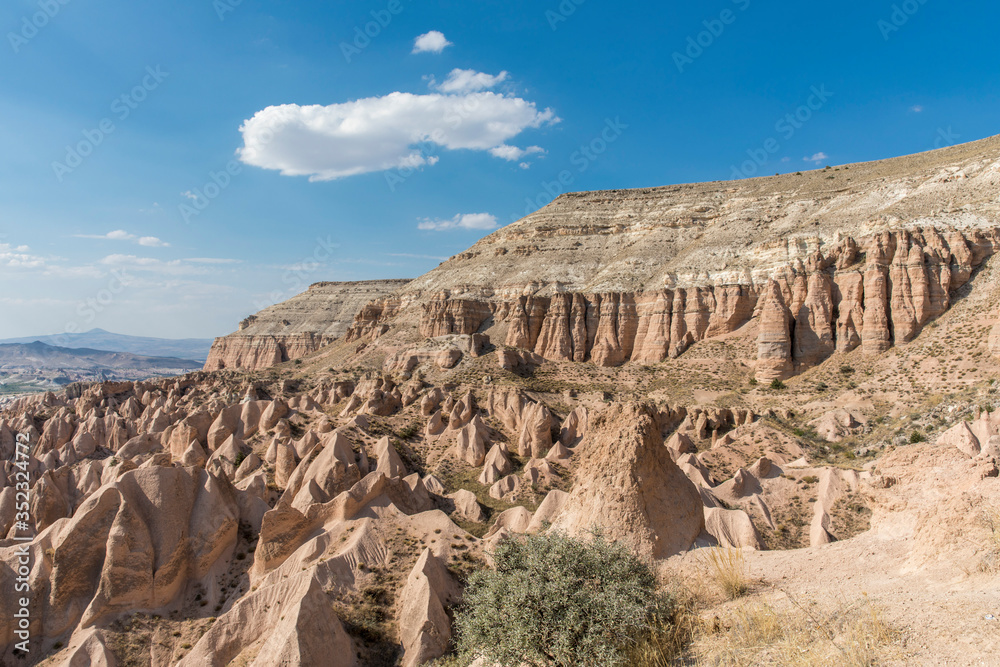 Volcanic formations in Red valley, Cappadocia, Nevsehir, Turkey.