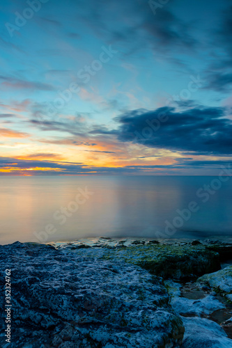 Cloudy summer sunset over ocean  Sweden