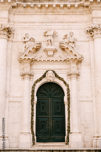 Sculptures of Angels above the entrance of Saint Blaise Church In Dubrovnik, Croatia © Nadtochiy