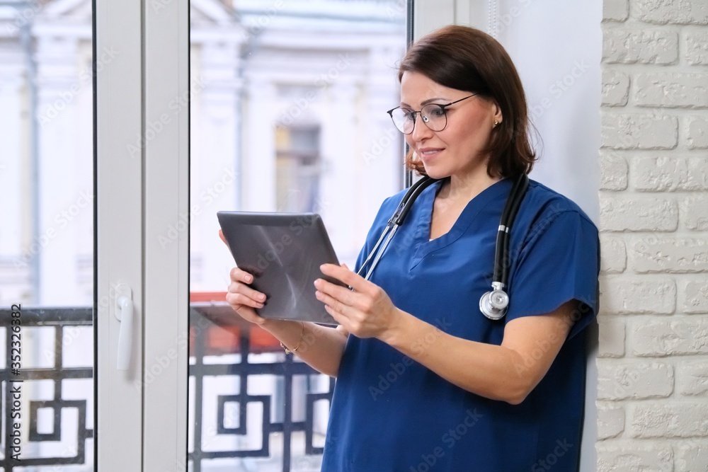 Female doctor talking online with patient using digital tablet, video call Female doctor talking online with patient using digital tablet, video call