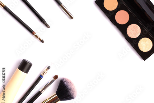 Set of female cosmetics on a white background with place for text.