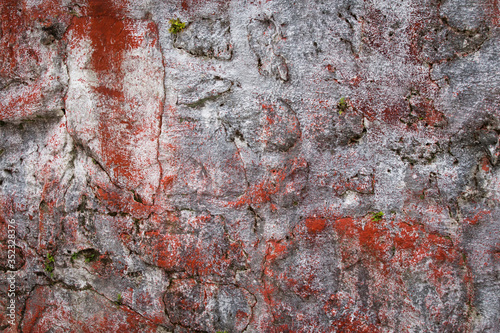 Wall texture painted in white and red, detail of rural art and vintade. 