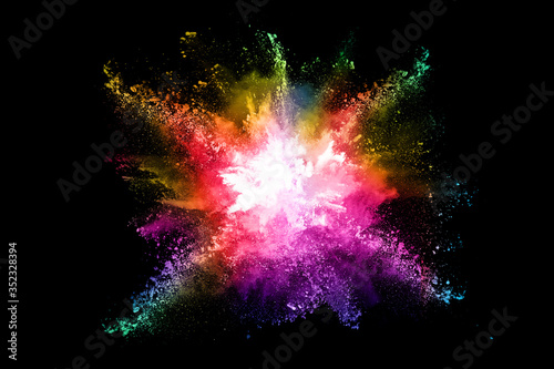 abstract colored dust explosion on a black background.abstract powder splatted background,Freeze motion of color powder exploding/throwing color powder, multicolored glitter texture.