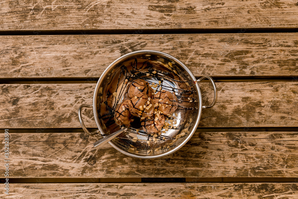 Chocolate ice cream in a silver bowl Chocolate ice cream in a silver bowl