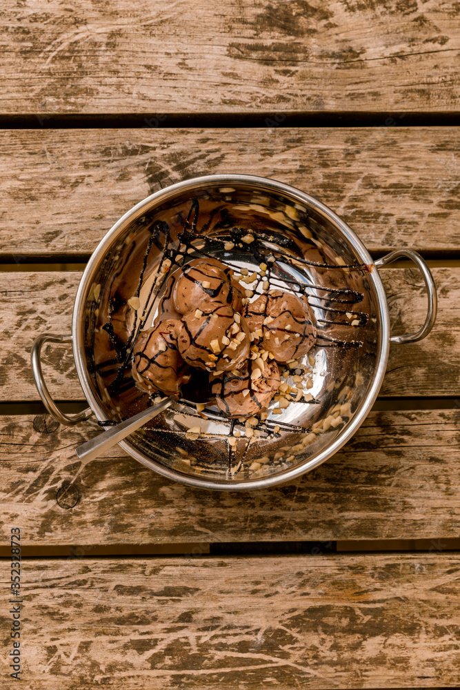 Chocolate ice cream in a silver bowl Chocolate ice cream in a silver bowl