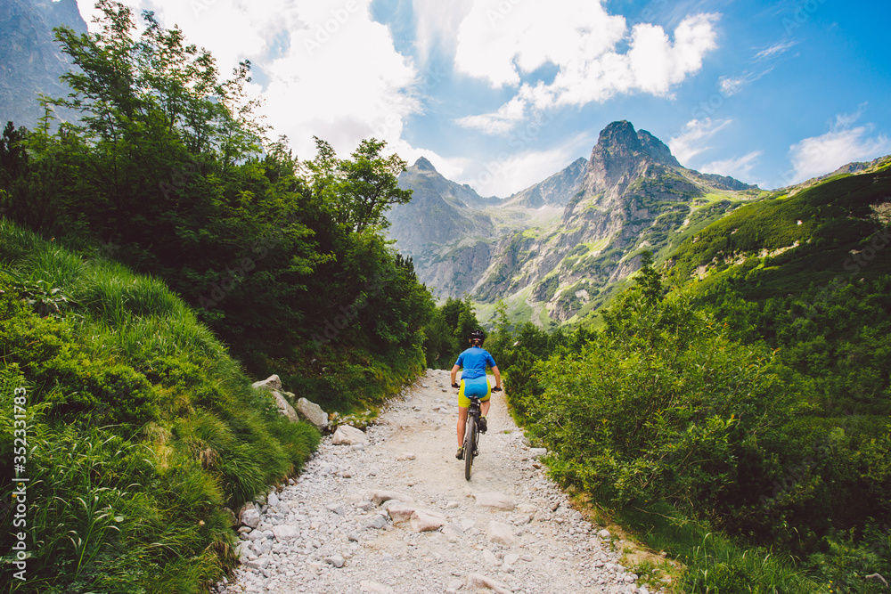 a cyclist riding in the high Tatras, Slovakia a cyclist riding in the high Tatras, Slovakia
