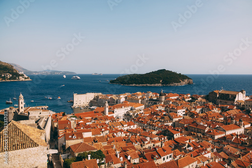 View from the wall on the roofs of the old city of Dubrovnik, the bell tower of the Dominican monastery, the dome of the church of St. Vlah and the Cathedral of the Assumption of the Virgin Mary