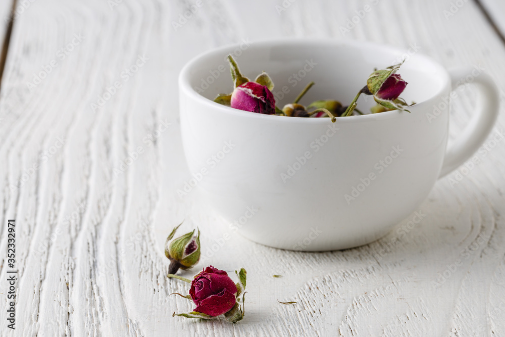 Floral tea with rose hips in bowl Floral tea with rose hips in bowl