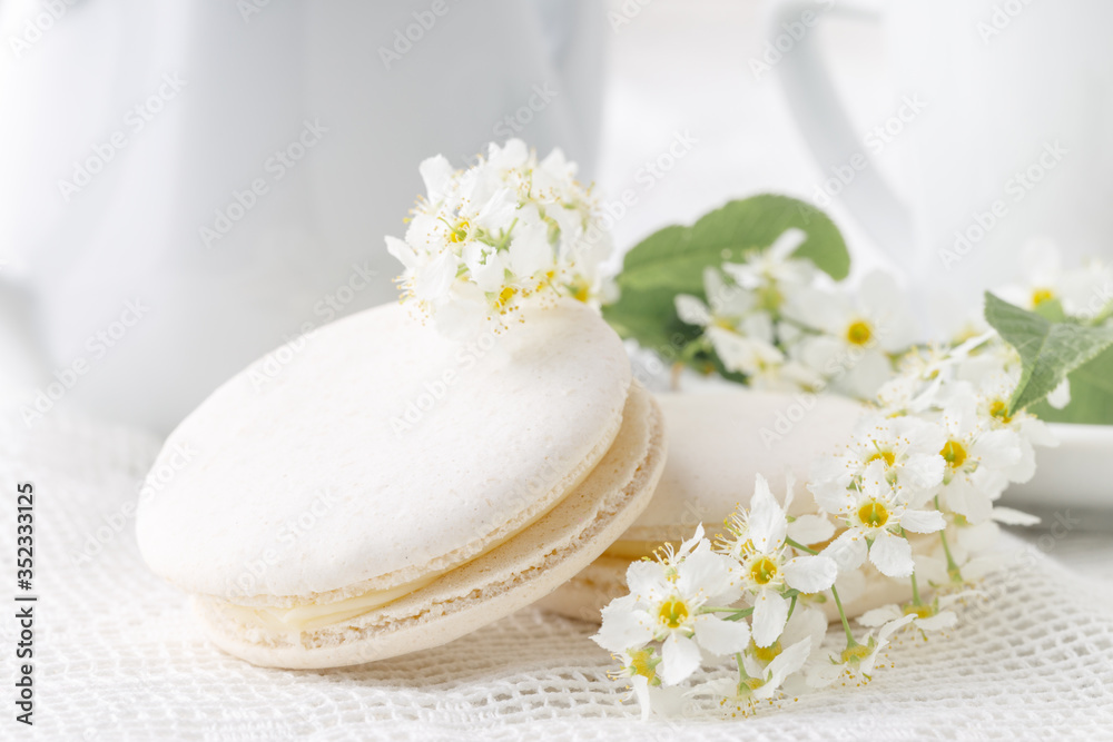 Coffee and French macaroons in white tone Coffee and French macaroons in white tone