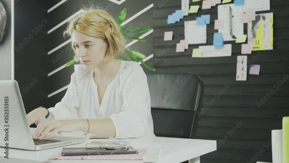 Business woman works with tablet in modern office Business woman works with tablet in modern office