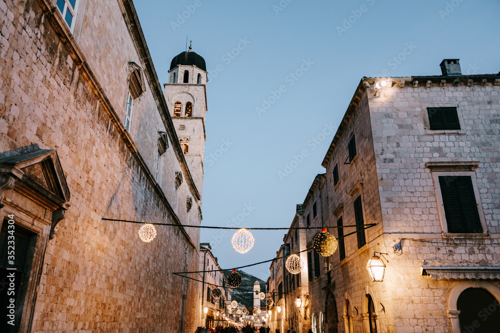 Christmas street decorations on the square of the old city of Dubrovnik in Croatia for the New Year. - obrazy, fototapety, plakaty 