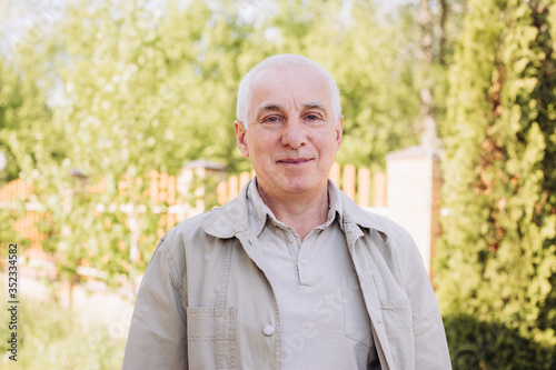 portrait of a smiling caucasian elderly man, senior man