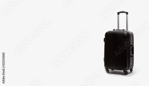 One black stylish suitcases. Place for text