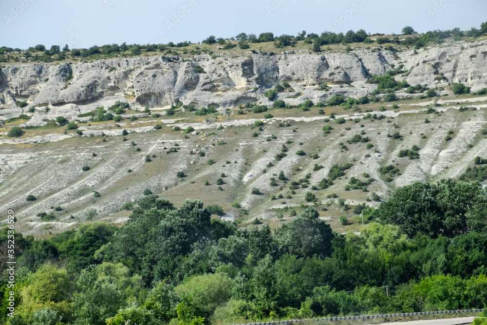 Limestone cliffs with sample of material, limestone erosion in the rocks. Limestone cliffs with sample of material, limestone erosion in the rocks.