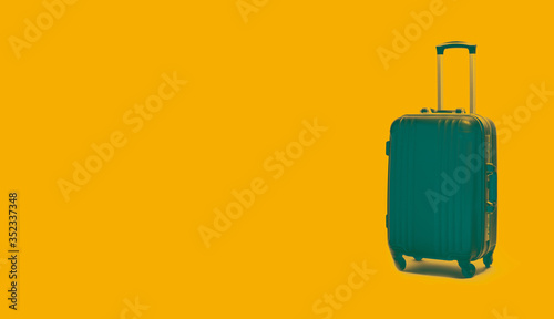 Stylish suitcase on a colored background. Collage in the style of art. photo