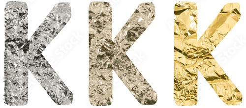 Isolated Font English or Latin or Russian letter K made of crumpled titanium, silver, gold foil on white background