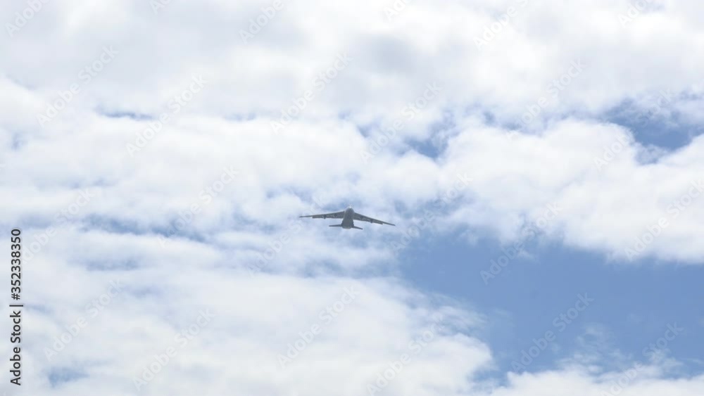 Flying a large cargo plane reduces the height of flying over the village Flying a large cargo plane reduces the height of flying over the village