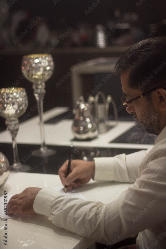 Man writing on a paper Man writing on a paper