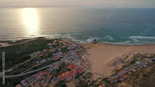 Aerial video shooting. Beach for surfing and relaxing for tourists Monte Clerigo on the Atlantic coast. Portugal, Sagres, Algarve, next to Costa Vicentina, Aljezur.