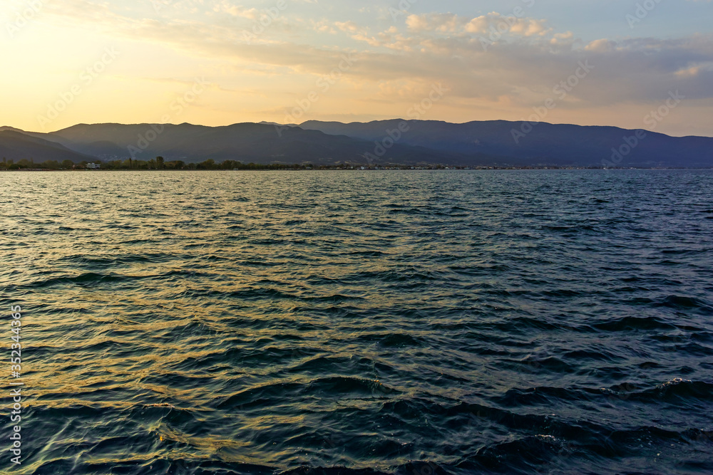 Fototapeta premium Sunset at coastline of village of Stavros, Chalkidiki, Greece