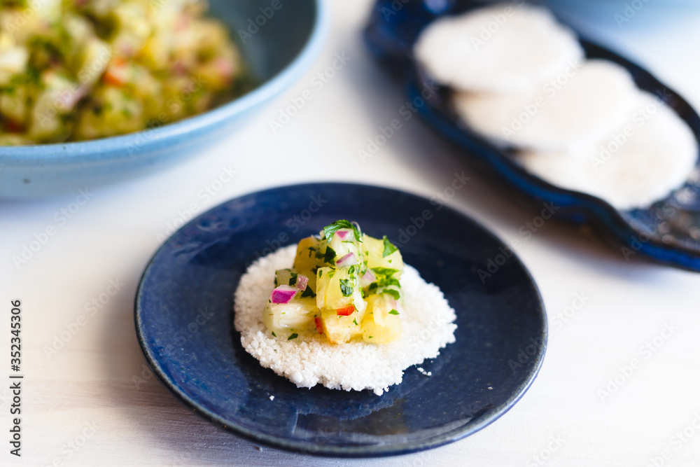 Ceviche with Tapioca on a blue and white background Ceviche with Tapioca on a blue and white background