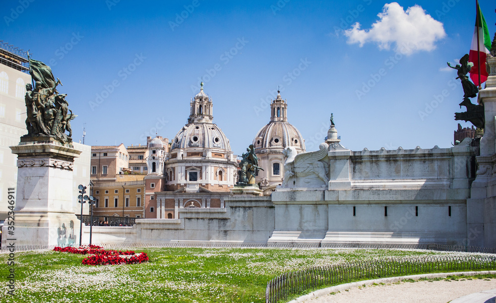 Garden, churches, monuments and italian flag in Rome city