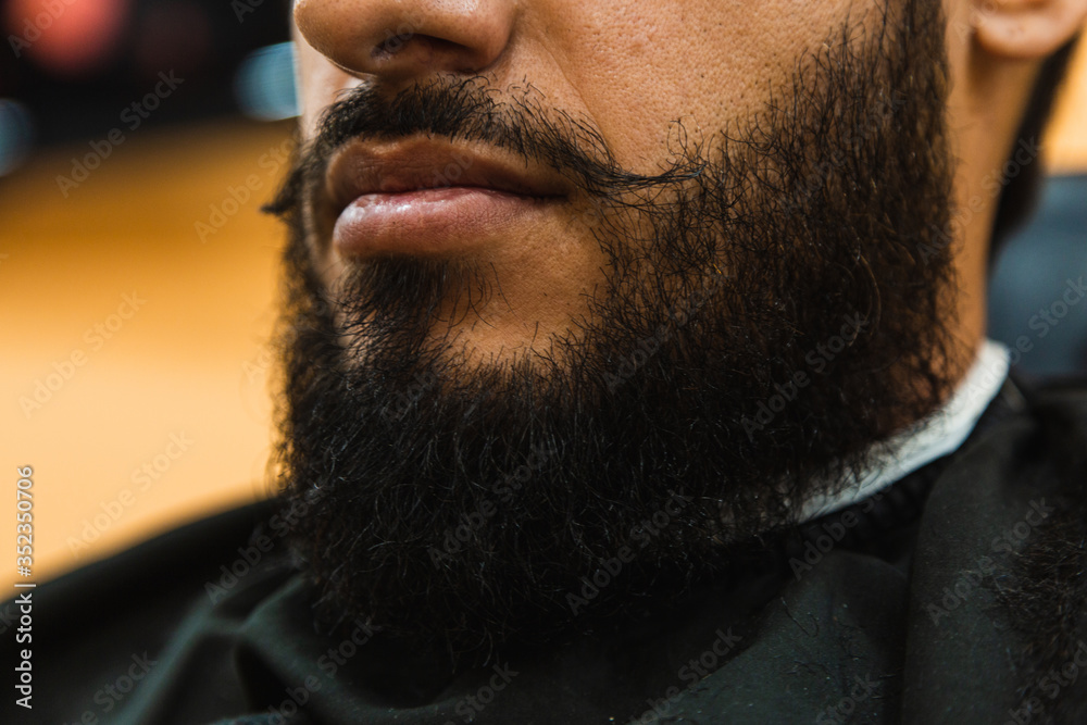 Fototapeta premium Portrait of a bearded man in the barbershop.