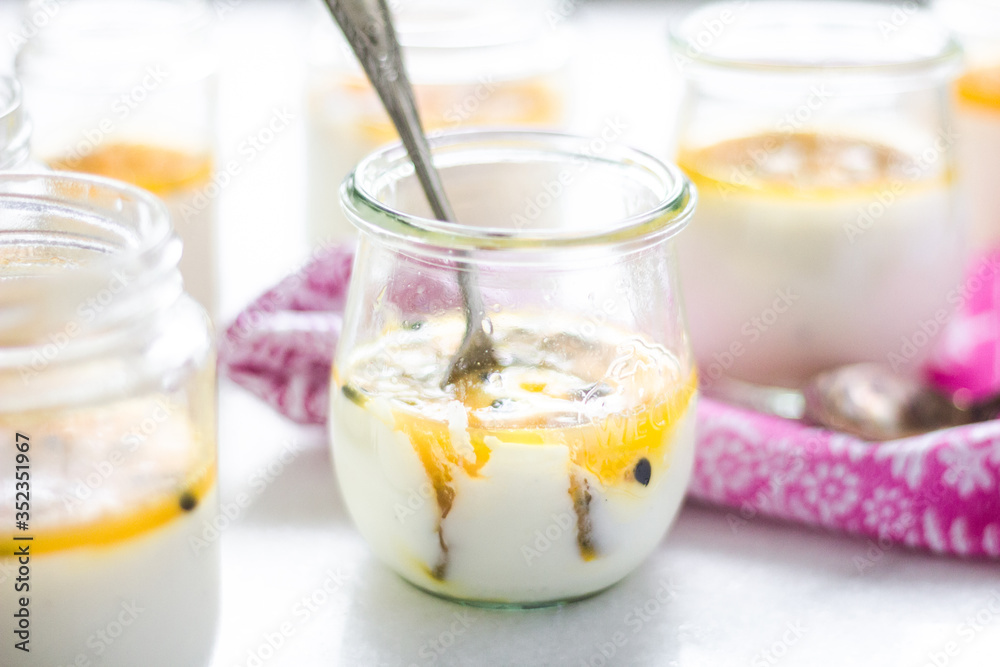passion fruit panna cotta on tiny glasses and pink napkin passion fruit panna cotta on tiny glasses and pink napkin