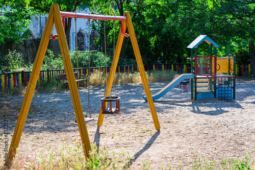Wallpaper Mural A playground with swing and children slides Torontodigital.ca