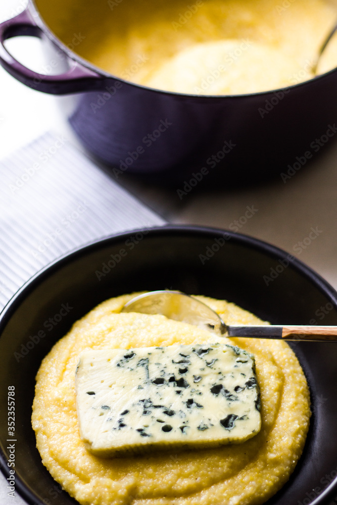 Polenta with blue cheese and black ceramic Polenta with blue cheese and black ceramic